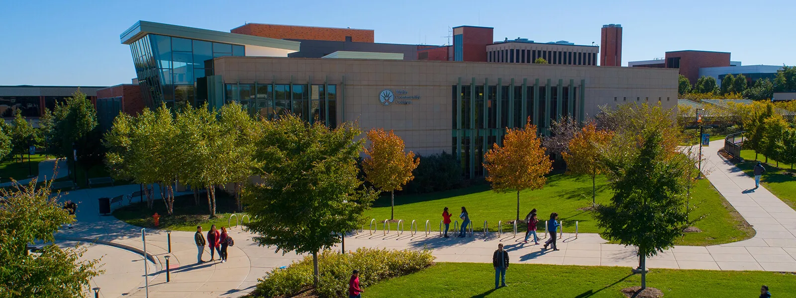 Aerial view of ECC campus in the fall with students enjoying being outside on a sunny day.