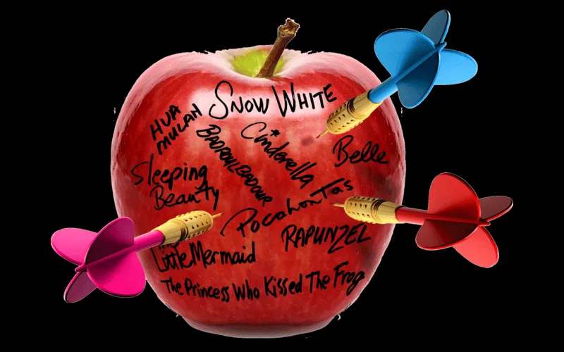 Apple with darts inside the fruit, and names scribbled on the outside.