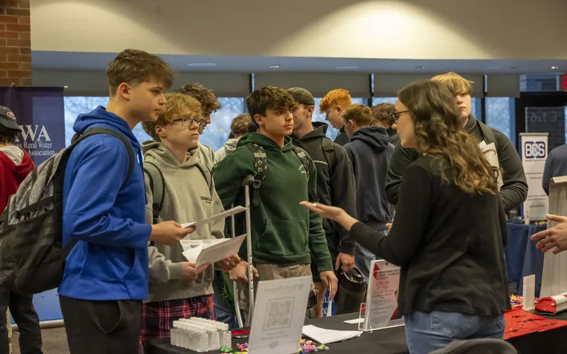 ECC students listen to a person presenting at a past Apprenticeship Expo.