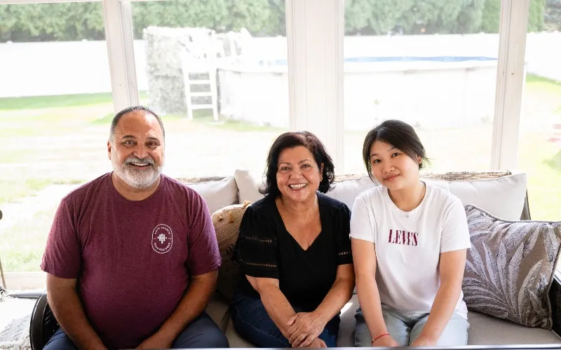 International Student Homestay Hosts Diana and Guillermo Felfe and international student Oanh Nguyen from Vietnam pose for a photo.