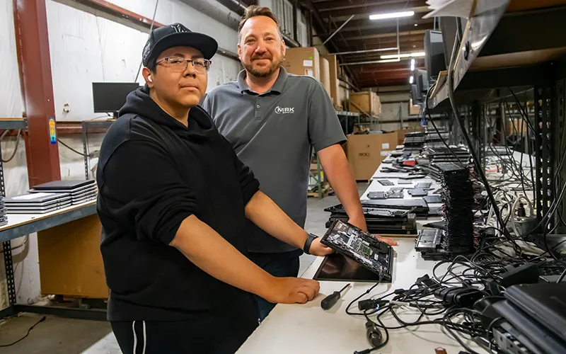 ECC student Joseph Patino (left) with Joe Ruffalo, vice president of operations at MRK
