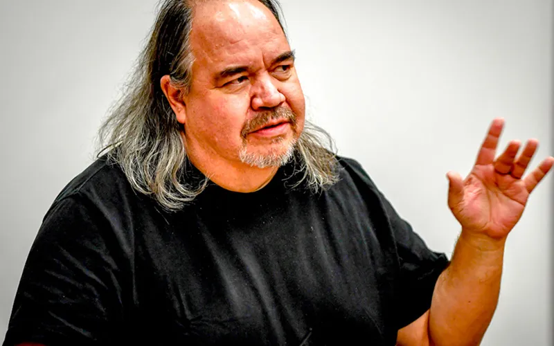 Poet Mark Turcotte speaks at an ECC event in 2017.