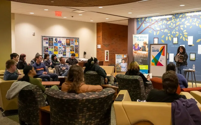 Chicago Poet Laureate Mayda del Valle speaks at the ECC Writer's Center Open Mic Coffee House in April 2026.