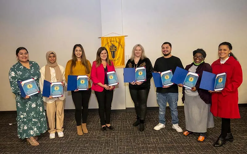 ECC adult education students from left to right: Maria Nino, Aysha Khan, Maria Garcia Moreno, Anna Ewko, Viktoriya Kondratyuk-Melnychuk, Christopher Rios, Detrice Bradley, and Aurora Aguirre