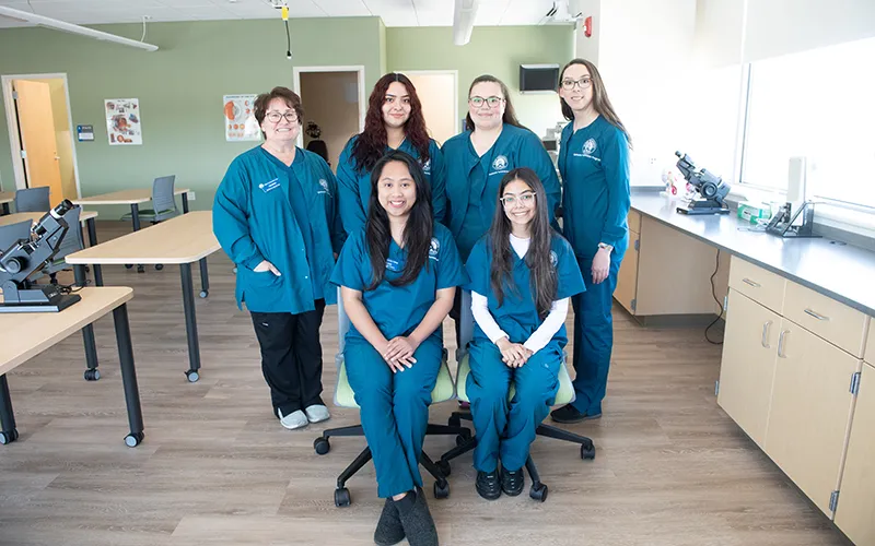Back row from left to right: Lori Marco, assistant professor of the ophthalmic technician program; ECC graduate Daisy Solorazano; ECC graduate Nicole Caldrone; and Shelby Stanley, ophthalmic technician program director. Front row from left to right: ECC graduate Kawla Jane Ballesteros and ECC graduate Kenya Hernandez