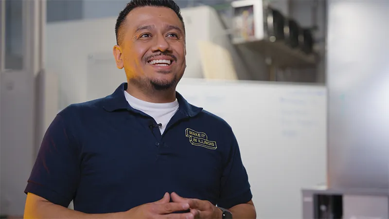 Reyes Estrada, ECC’s instructional coordinator for HVAC, smiles in a video produced by Elgin Community College.