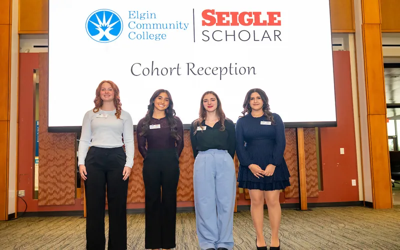 Four new Seigle Scholar recipients pose for a group photo at September 24 reception.