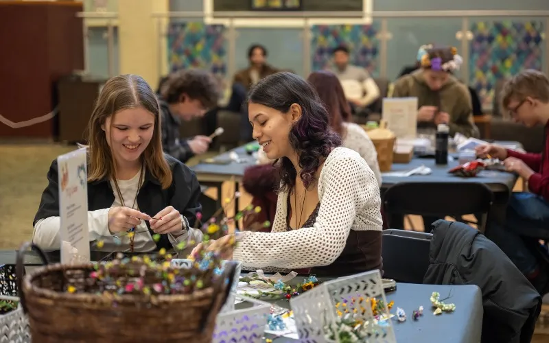 Two ECC students participate in a craft during Welcome Weeks events in January 2026.