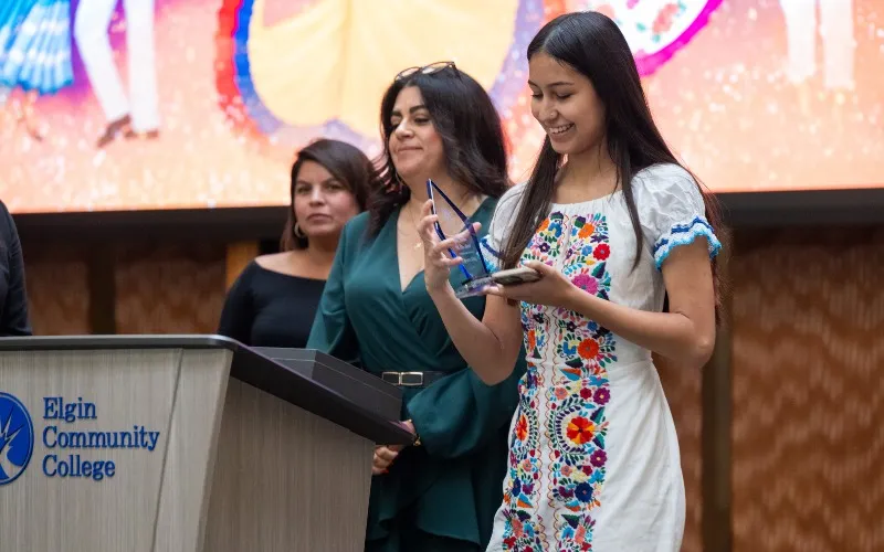 Individuals stand on stage during the Jane Barbosa Legacy Brunch in September 2025.