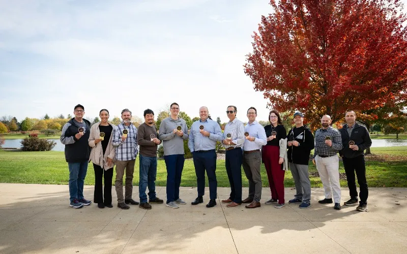 Multiple members of the Marketing & Communications department pose with their NCMPR Medallion awards. From left to right: Chris Foster, Kayla Sayler, Doug Danley, Kaile Raimondi, Adam Vial, Mark Branson, Eric Semelroth, Scott Piner, Sara Hogshead, Chaz Howard, Jay Conglis and Ryan Klassy.