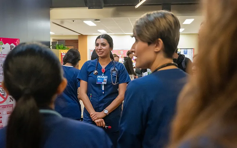 Nursing students chat during an ECC event.