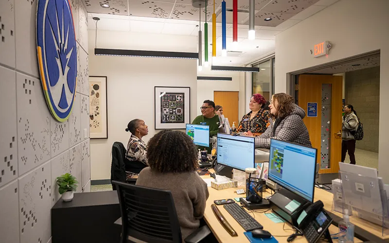 ECC staff chat at the open house for the office for Student Access & Disability Services.