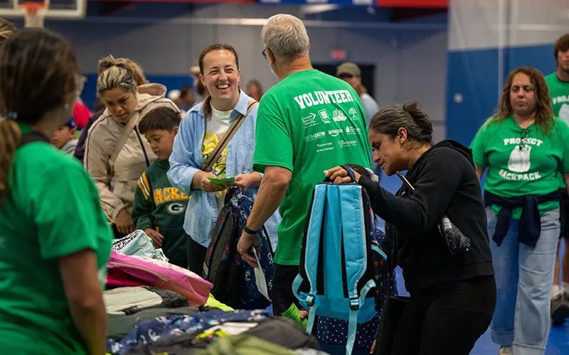 Many people look at backpacks and smile at the 2026 Project Backpack school supply giveaway event.