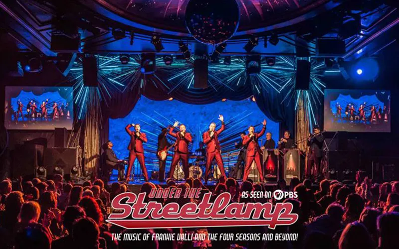 Actors dancing on stage for the Under the Streetlamp production.