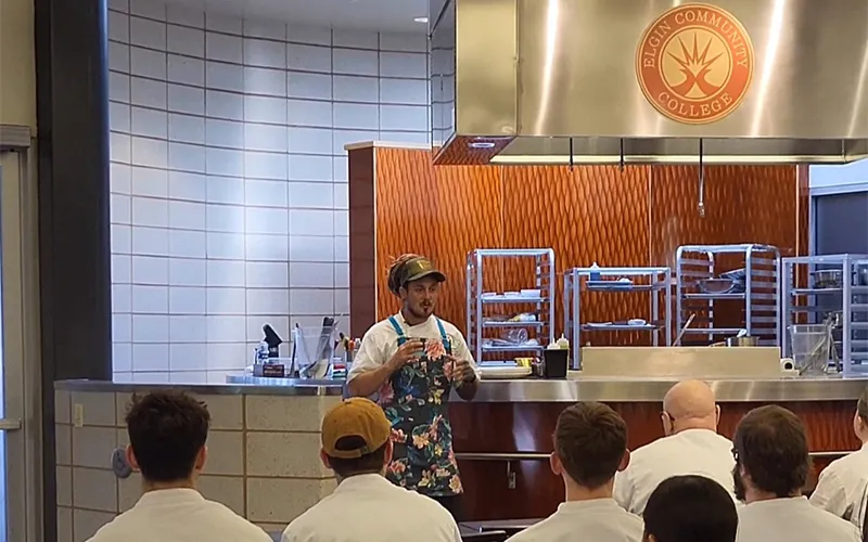 Chef Zach Laidlaw performs a demo in front of ECC culinary students.