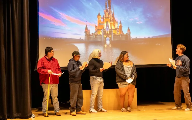 ECC communication students perform a story about a trip to Disney World for local second grade students, who wrote the stories.