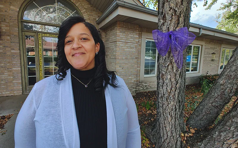 CRSS graduate Antoinette Herring poses outside of her work, Serenity House Counseling Services in Addison, Illinois.