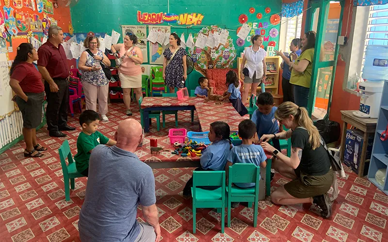 ECC employees visited Succotz Primary School in Belize where they chatted with staff and students.