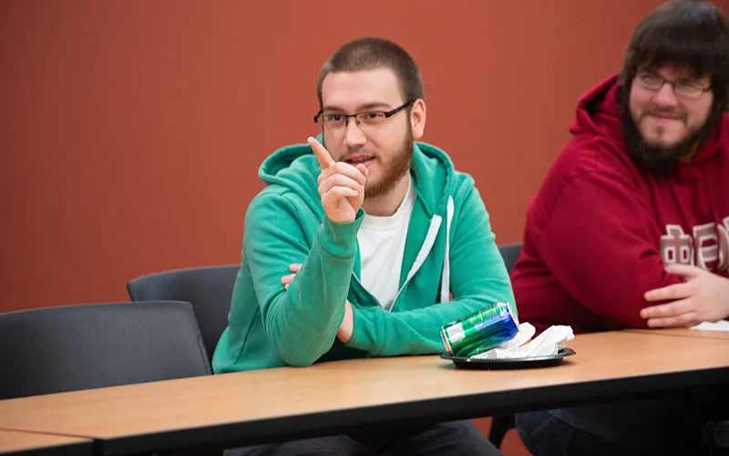 A person talks during a past Socrates Cafe discussion.