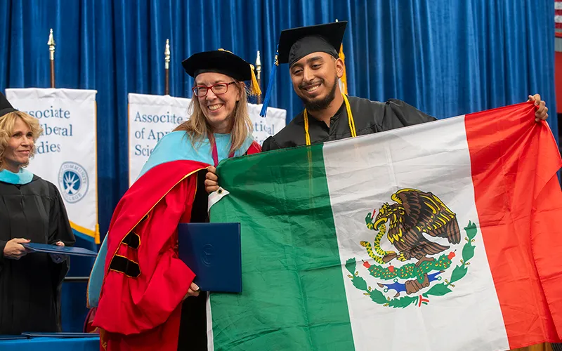 Peggy Heinrich, EdD, president of Elgin Community College, with an ECC graduate