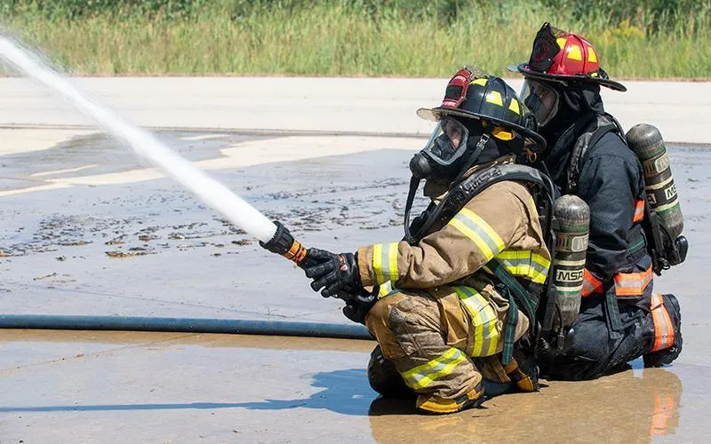 ECC student practices fire hose procedure