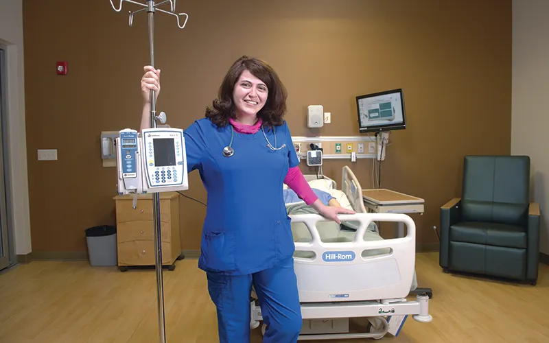 ECC alumna Cathleen Nesheiwat cares for COVID-19 patients.