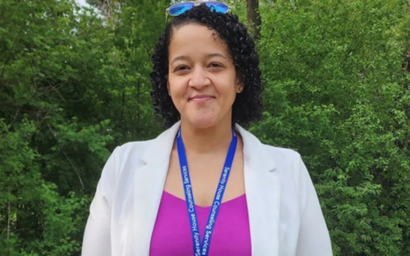 CRSS Graduate Antoinette Herring poses outside her work, Serenity House Counseling Services.
