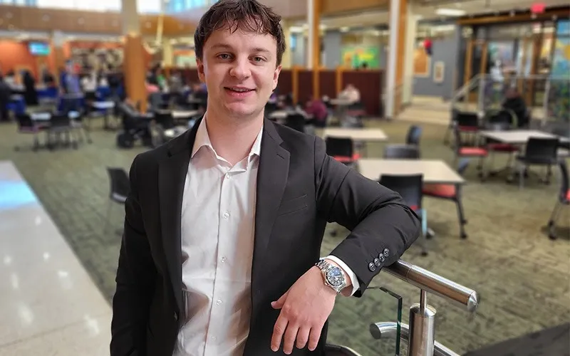 Student Bohdan poses in front of Jobe Lounge.