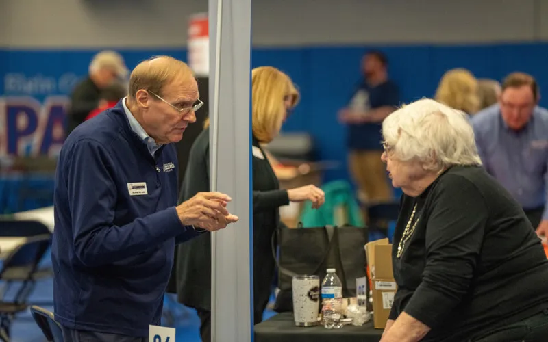 Two individuals chat at the Thrive After 55 event in 2025 at ECC.