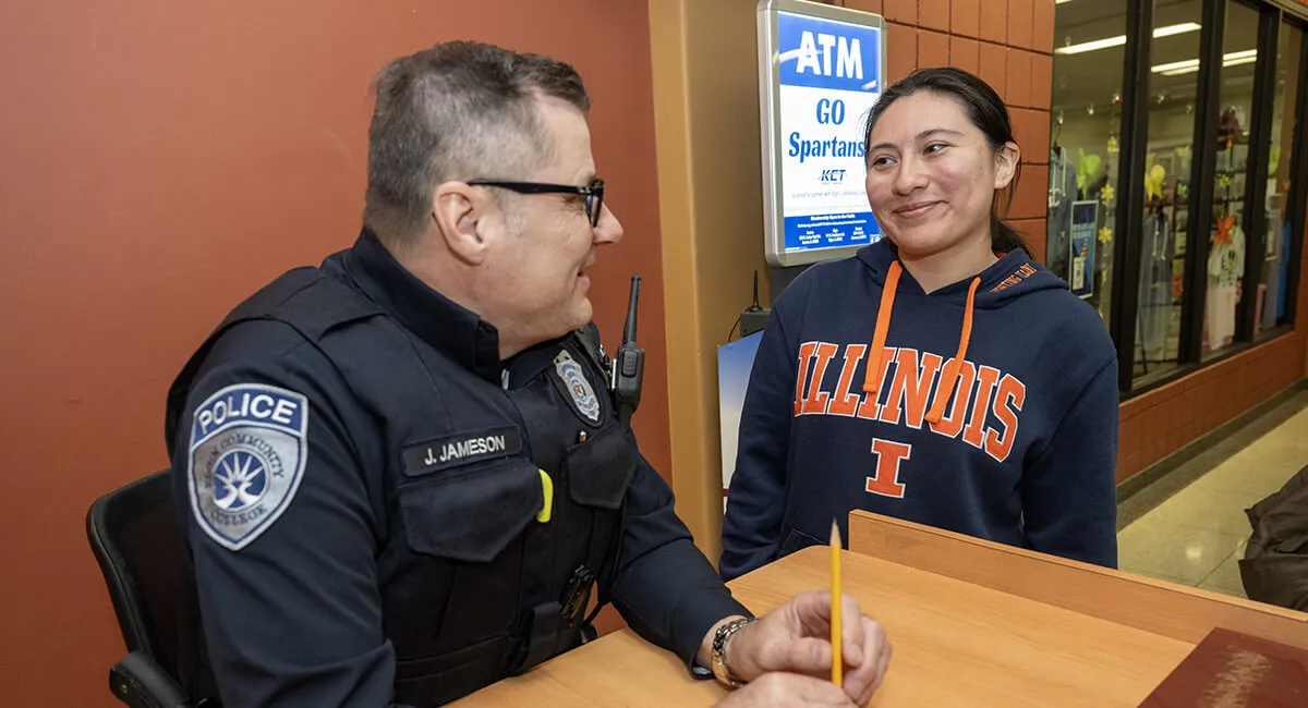 A student talking with an officer
