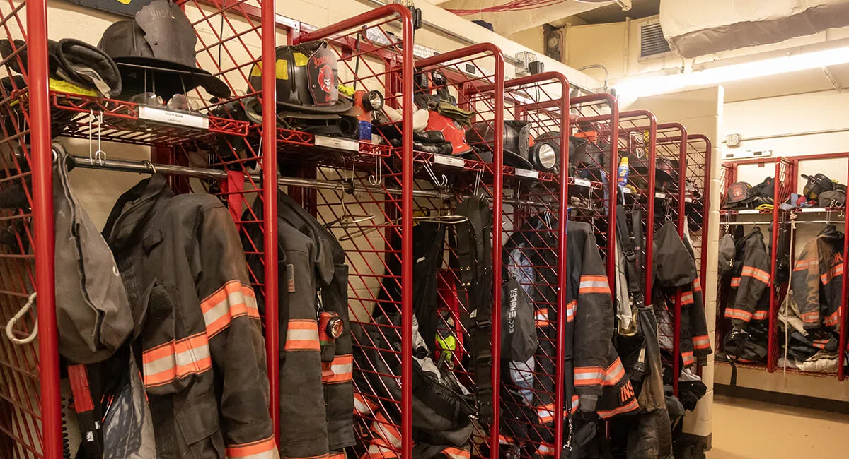 A photo of firefighter gear in a tog room