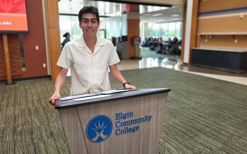 A student stands at a podium