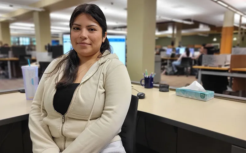 A student sits in the library