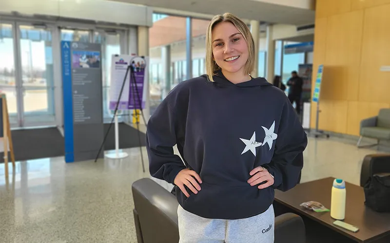 ECC Student Dani Macmillan stands in Building A