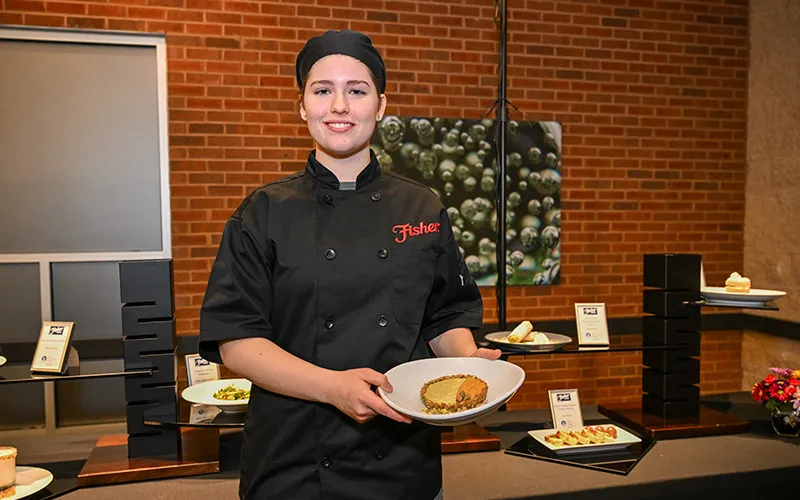 ECC culinary student Lynn Stringini, first-place winner of the annual Fisher Nuts scholarship recipe contest with her Pistachio Panna Cotta and Pumpkin Chiffon Tartlet