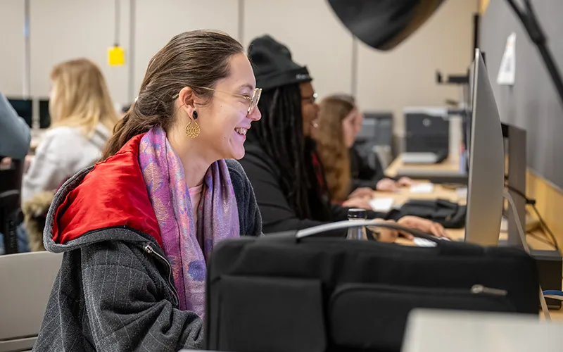 A student sits at a computer