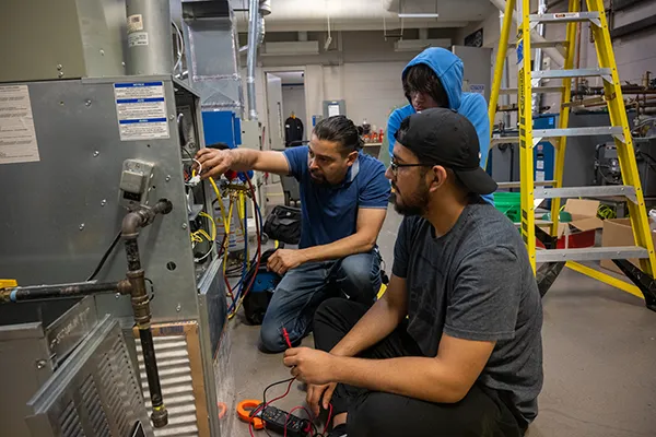 Manufacturing teacher and student working in the classroom