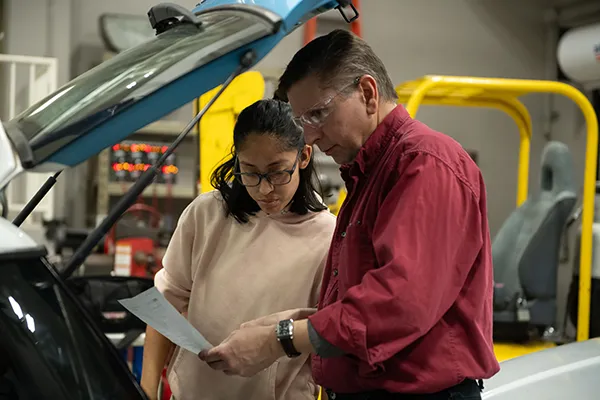 Automotive instructor with student