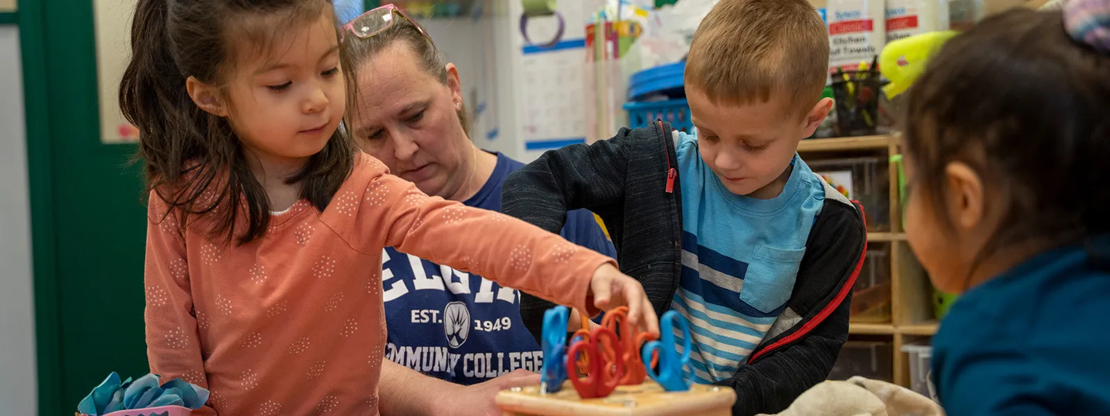 Children playing with toys from the ECC child care center.