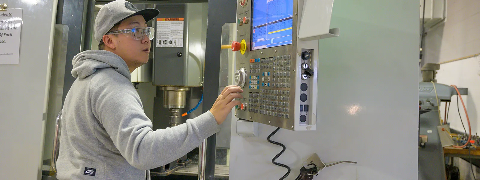 Student at a control panel