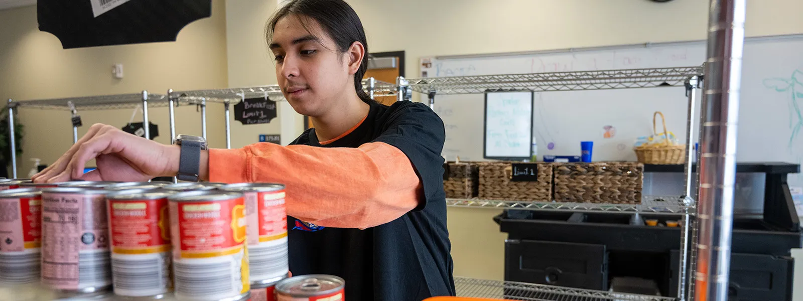 student volunteering at the Spartan Food Pantry