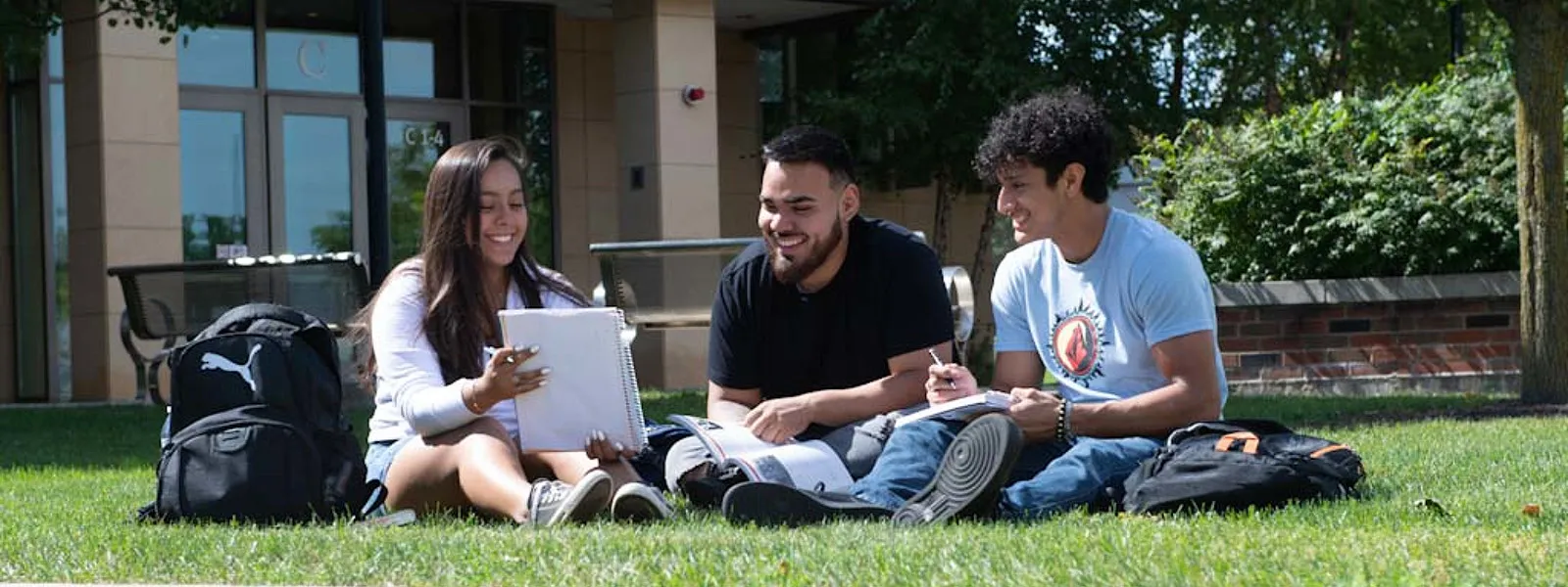 Student sitting on lawn