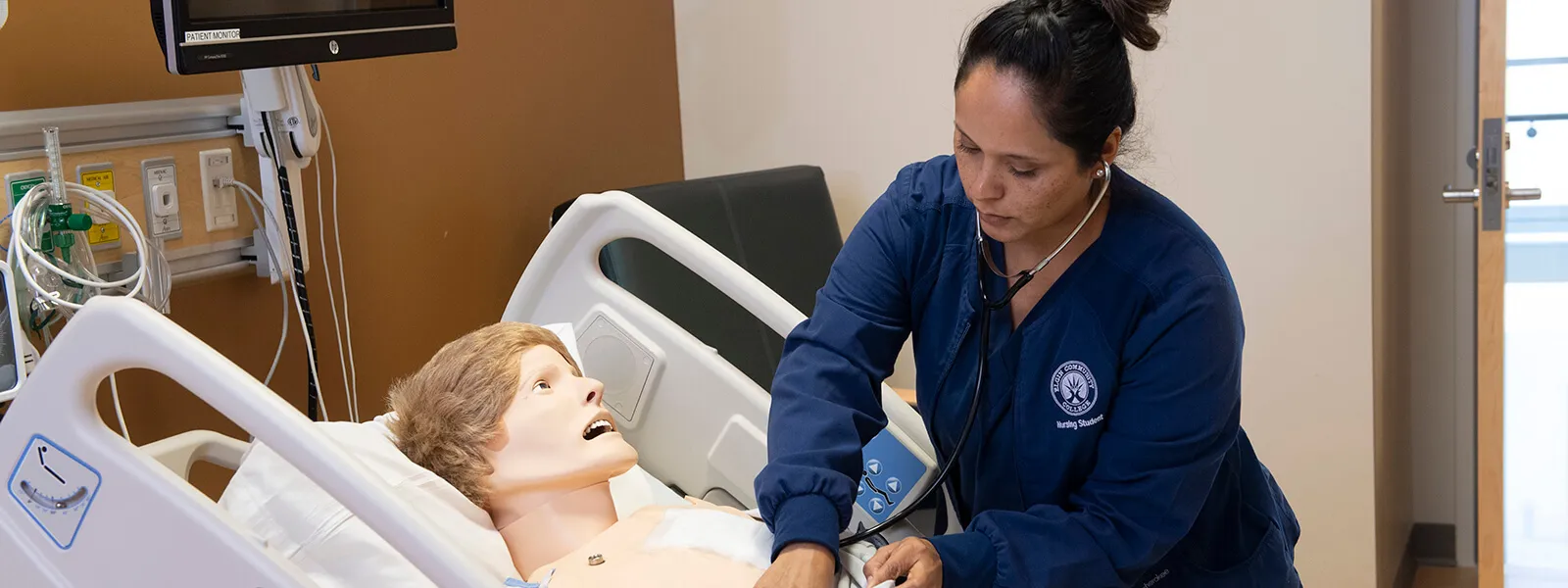 Nursing student with dummy