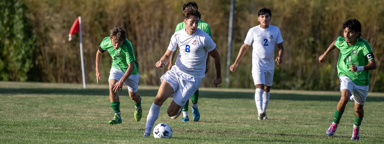 ECC students playing soccer against another team