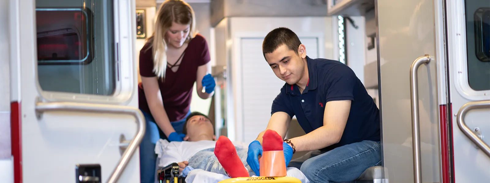 Emergency medical technician students in ambulance