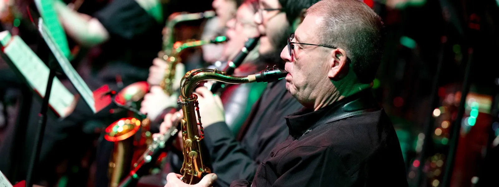 A man playing a trumpet in the jazz lab band ensemble