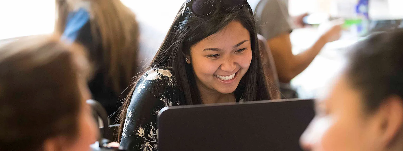 Image of student doing homework in front of her computer.