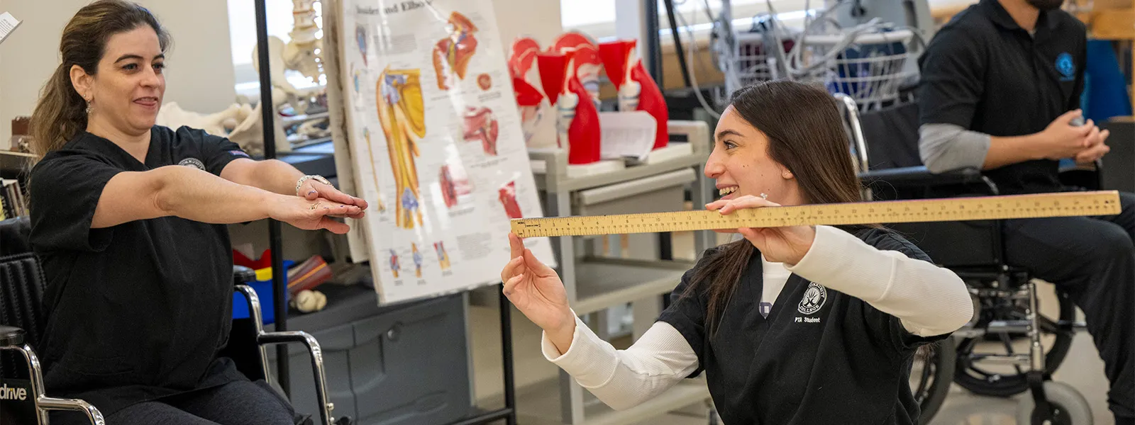 Physical therapy student with instructor