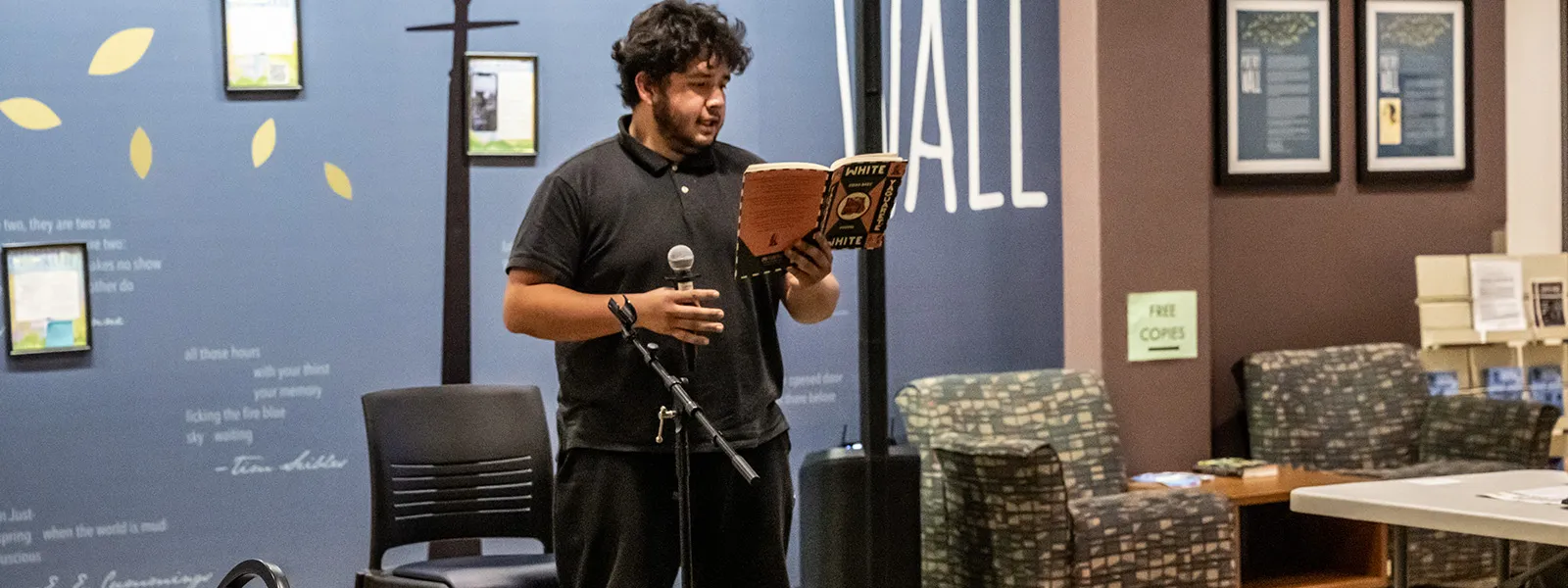 A student reads during the coffee house presentation