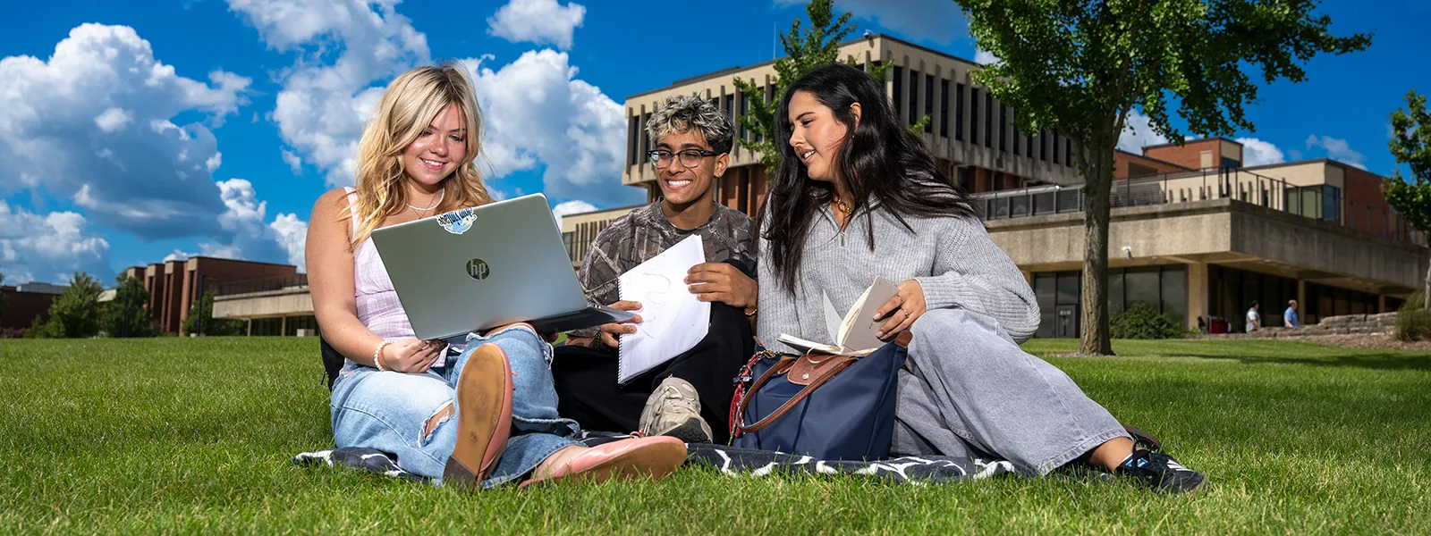 Students sitting on lawn